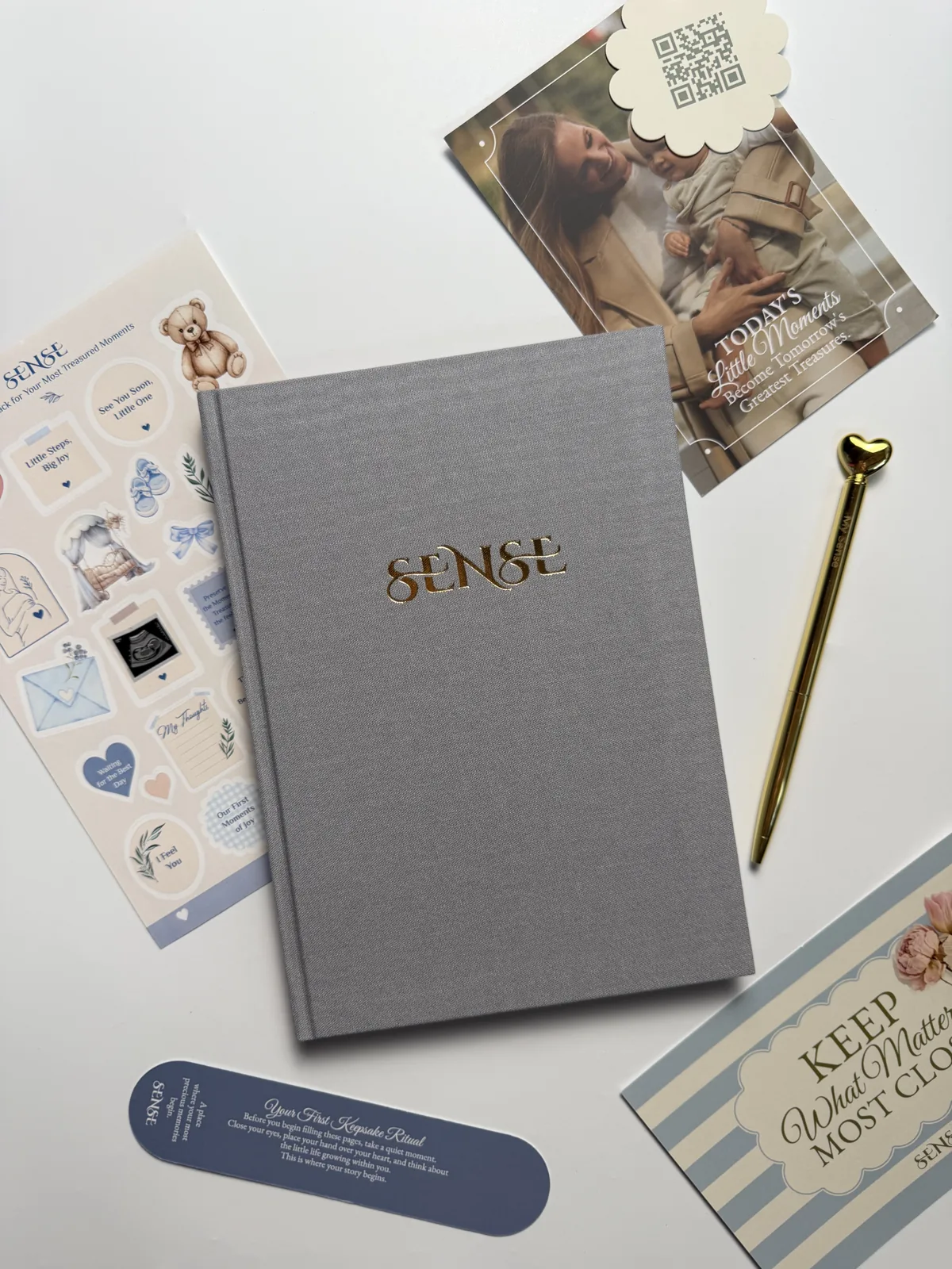 Grey English-edition SENSE pregnancy journal with stickers and a card